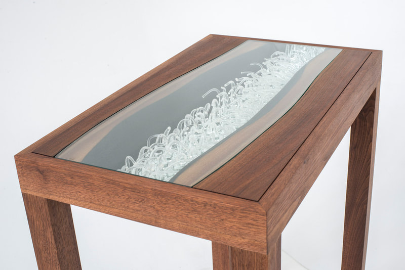 Custom side table with hand blown glass detail in table top. 